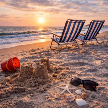 Beachside sunset with seashells and chairs